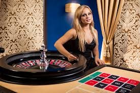 Live Baccarat studio with dealer dealing cards, multi-camera view on alexa togel